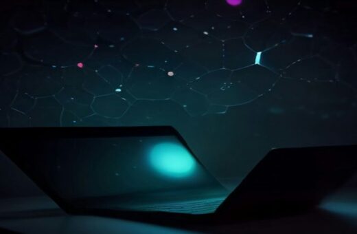 Computadora portátil abierta en una habitación oscura con la pantalla iluminada en azul y una red de puntos y líneas brillantes al fondo